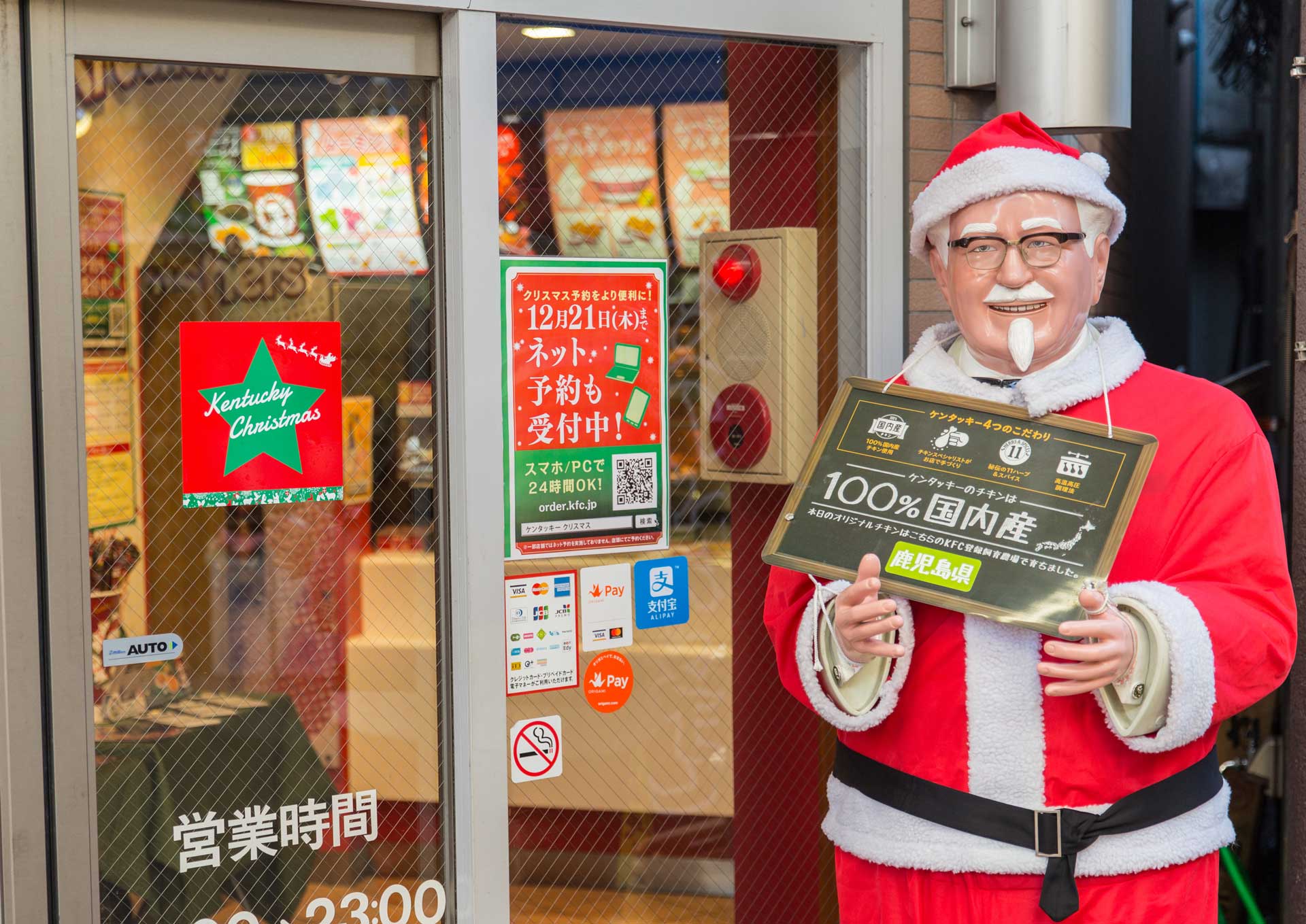 Japanese KFC at Christmas, with a Colonel Sanders statue dressed like Santa