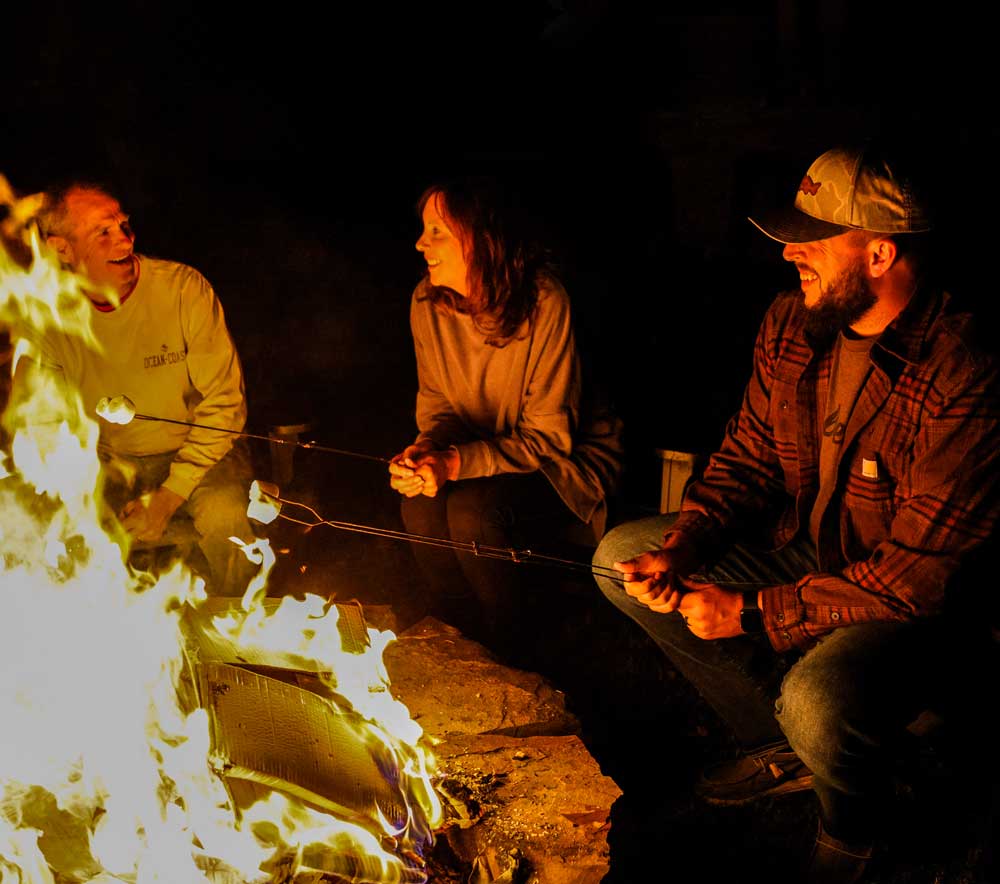 Roasting marshmallows around a campfire